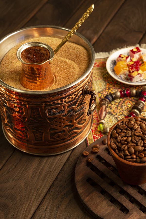 Traditional Turkish Coffee in Cezve Prepared on Hot Sand. Stock Image