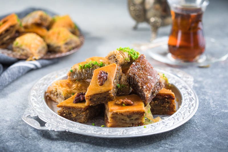 Traditional Turkish Desserts Baklava with Tea. Crispy Mix Baklava on ...