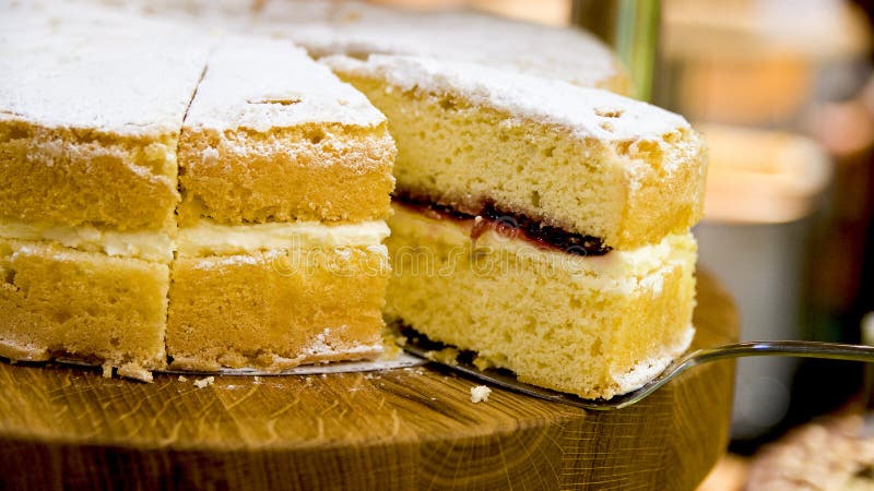 Traditional Victoria sponge cake. With strawberry jam and whipped cream royalty free stock images