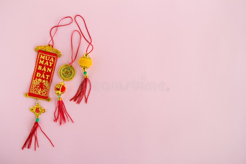 Traditional Vietnamese and Chinese New Year decorations red and golden colors on a pink background. stock photo Traditional Vietnamese and Chinese New Year decorations red and golden colors on a pink background. stock photo