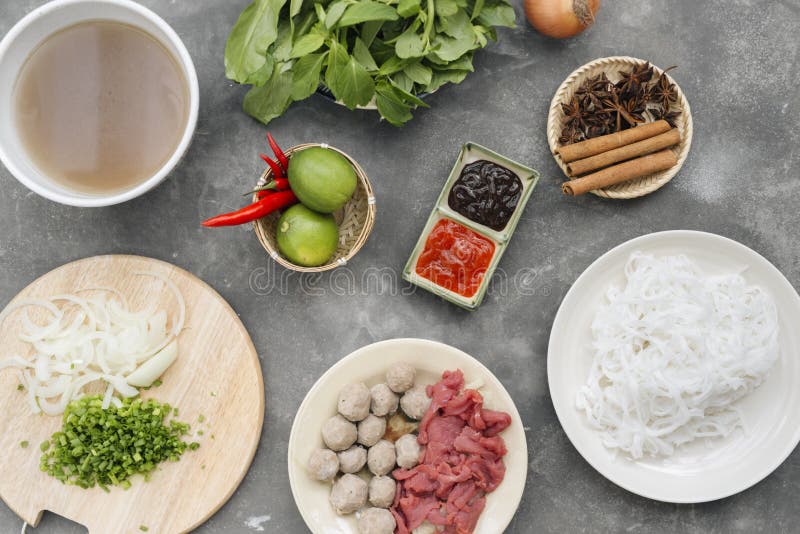 Traditional vietnamese noodle soups pho in bowls, concrete background. Vietnamese beef soup pho bo, Close-up. Asian/vietnamese