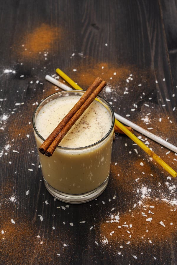 Traditional Winter Eggnog with Milk, Rum and Cinnamon, Sprinkle with Grated  Nutmeg. Cocktail Straws, Dark Wooden Background Stock Image - Image of  cocoa, celebrate: 166078745