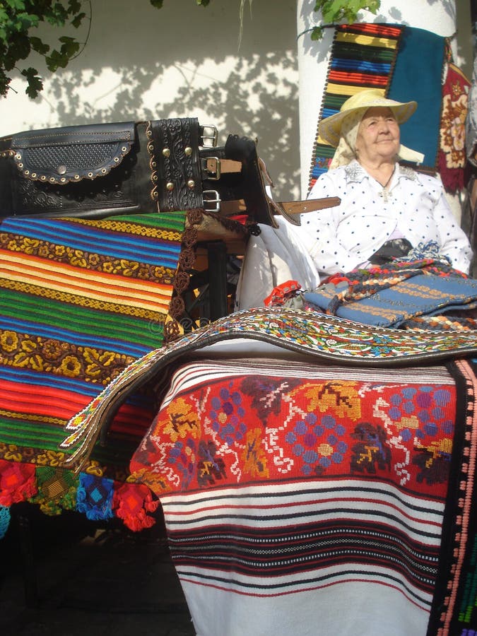 Traditional woven rugs stall at traditional ware fair at Romanian Peasant Museum in Bucharest, Romania on September 13, 2015 royalty free stock image Traditional woven rugs stall at traditional ware fair at Romanian Peasant Museum in Bucharest, Romania on September 13, 2015 royalty free stock image