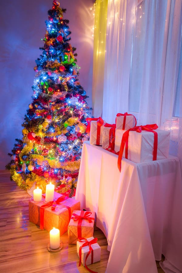 Traditionally Christmas Tree with Gifts for Christmas Stock Photo