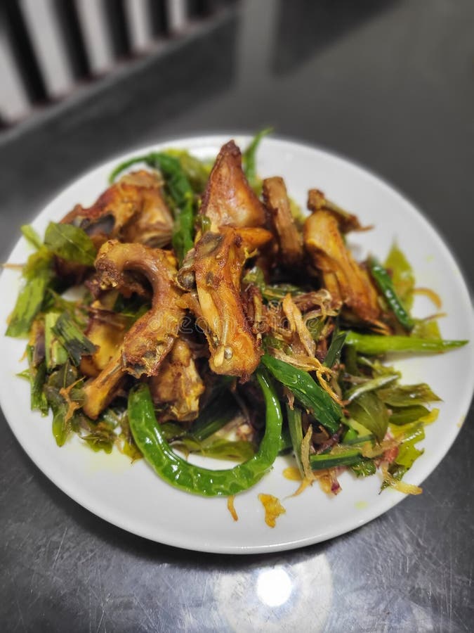 Traditionally Seasoned Fried Chicken with Curry Leaves Stock Photo