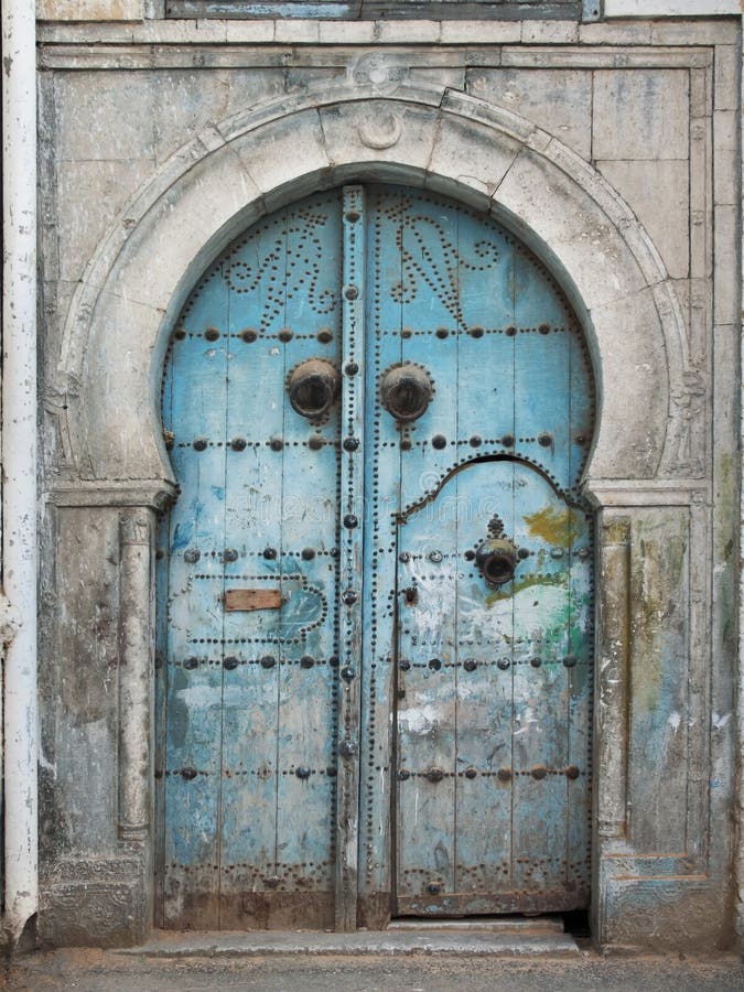 Damaged old Tunisian front door. Damaged old Tunisian front door