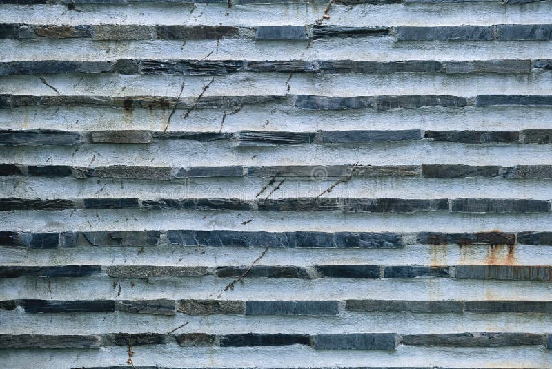 Traditional slate stone bricks and white concrete wall, mountain architecture detail. Traditional slate stone bricks and white concrete wall, mountain architecture detail