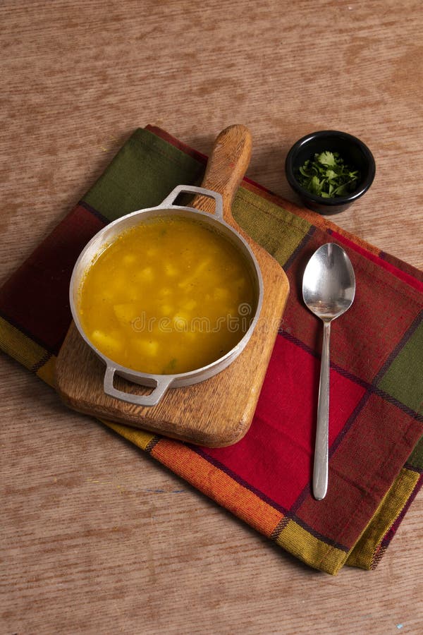 Traditional Colombian potato soup to accompany lunch. Creole potato soup view from above with space por text. Traditional Colombian potato soup to accompany lunch. Creole potato soup view from above with space por text