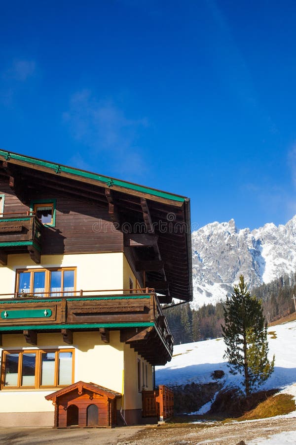 Traditional mountain chalets on a cold sunny day with blue sky. Traditional mountain chalets on a cold sunny day with blue sky