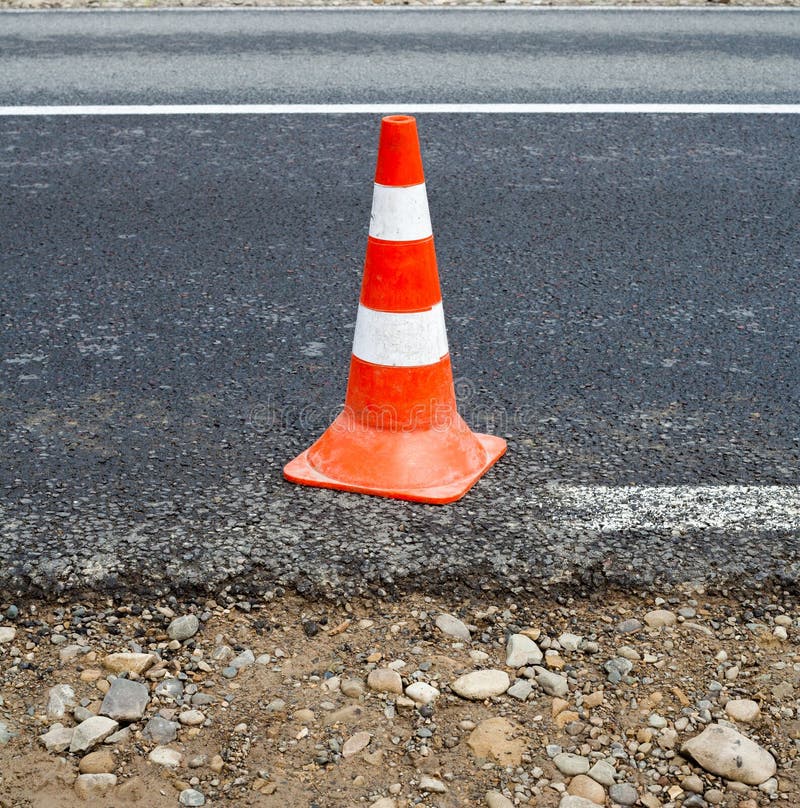 Traffic cone on the road stock image. Image of concrete 261631441