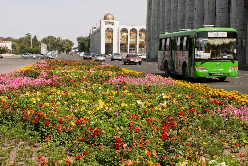 Traffic on the green streeet with local buses & cars