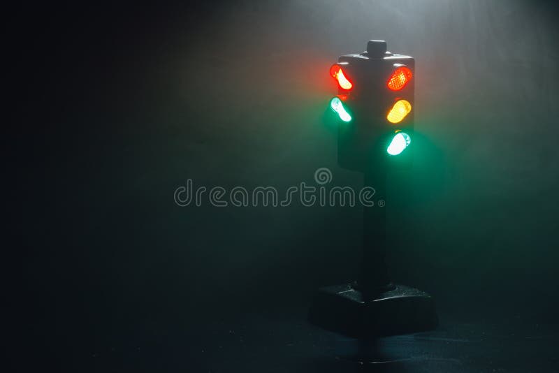 Traffic Lights, Pedestrian Green Light and Sign at Night Stock Photo