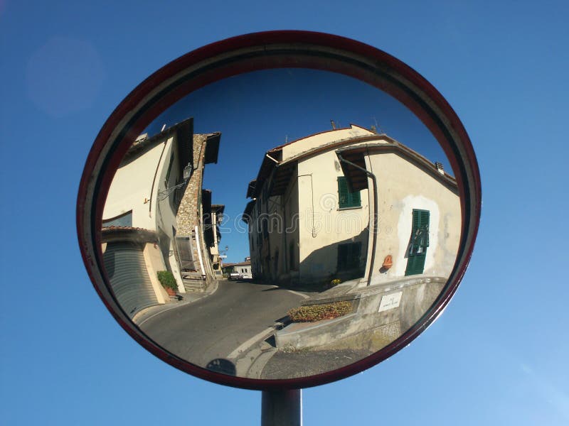 Traffic mirror reflecting small town