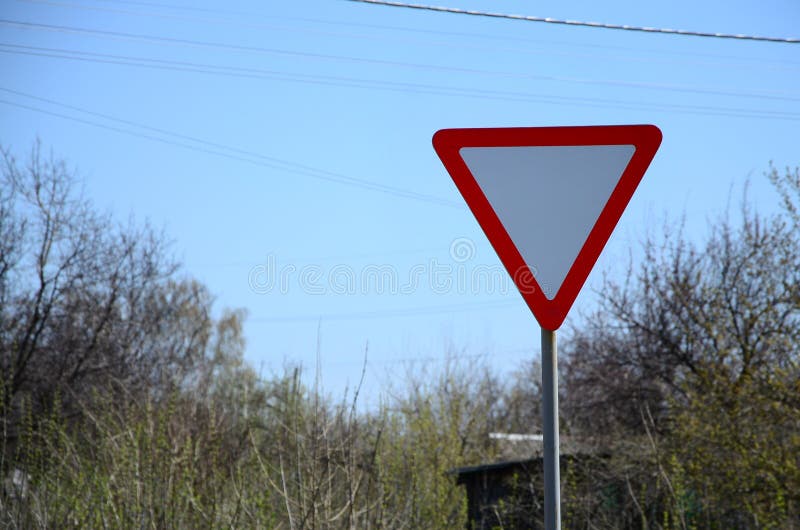 Traffic Sign in the Form of a White Triangle. Give Way Stock Image