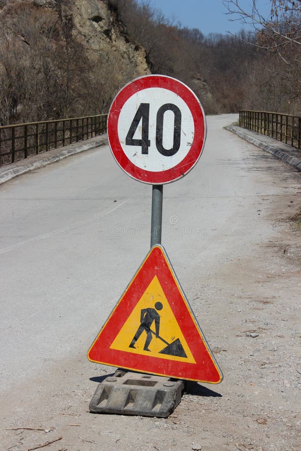 Traffic Sign in Middle of Road Stock Image - Image of security, white