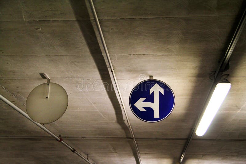 Traffic sign one way street sign in underground parking garage / Car parking bar in area in department store. royalty free stock image Traffic sign one way street sign in underground parking garage / Car parking bar in area in department store. royalty free stock image