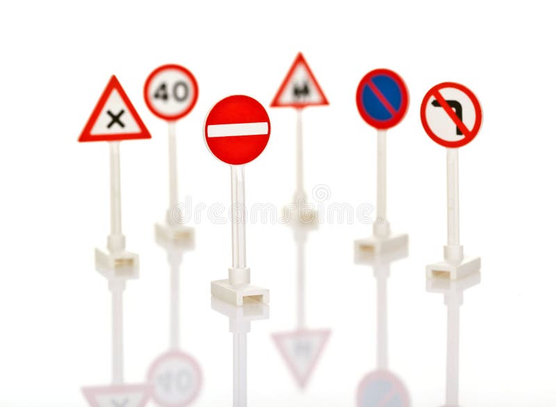 Collection of traffic signs, isolated on white background with shallow DoF