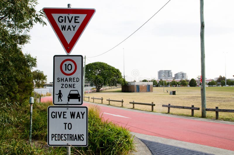 Traffic warning signs for give way, shared zone speed limit 10 km/hr and give way to pedestrians, the image of three traffic signs stock photo Traffic warning signs for give way, shared zone speed limit 10 km/hr and give way to pedestrians, the image of three traffic signs stock photo