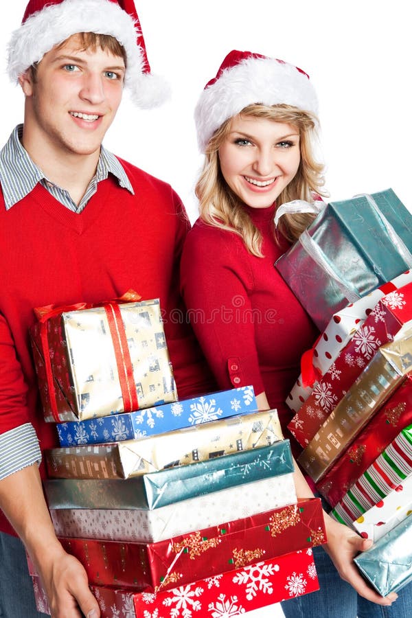 Tragende Geschenke der Weihnachtseinkaufen-Paare stockfotos Tragende Geschenke der Weihnachtseinkaufen-Paare stockfotos