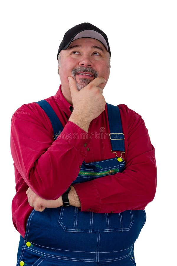 Tragende Jeansstoffe des durchdachten Arbeiters stockbilder Tragende Jeansstoffe des durchdachten Arbeiters stockbilder