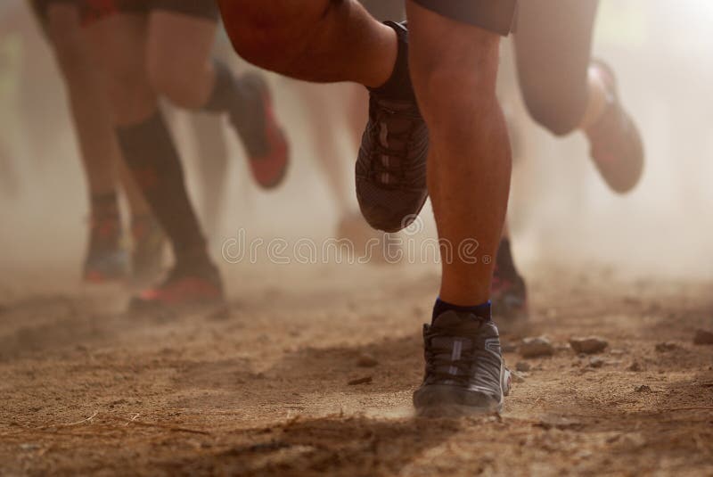 Trail running group on mountain path