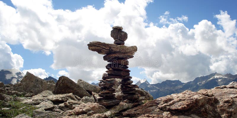 Trail Sign. Man like stone pyramid. Caucasus Mountains vintage effect.