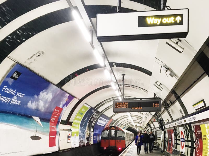 Train arriving at the station, an underground train station, London, England royalty free stock image