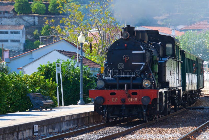 Train coming to the station at Pinhao in Douro Valley, Portugal