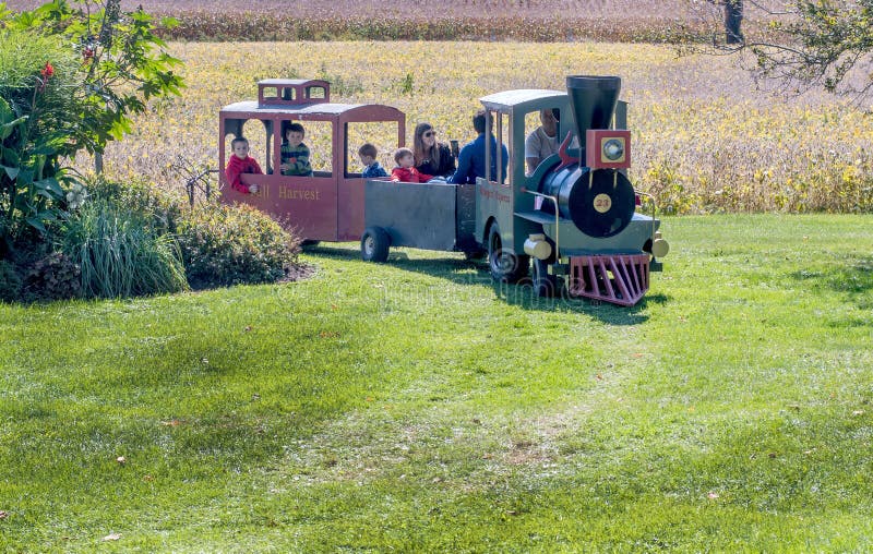 Train drives delighted visitors through a pumpkin farm stock photography Train drives delighted visitors through a pumpkin farm stock photography