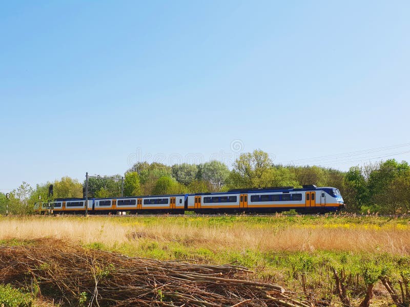 Train passing in a open field stock images Train passing in a open field stock images