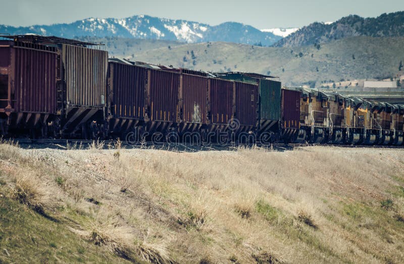 Train Shipping Grain Pulled by Union Pacific Locomotives