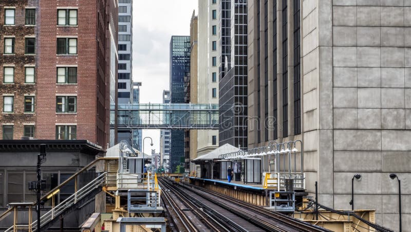 Train Station on Elevated tracks within buildings at the Loop, Glass and Steel bridge between buildings Chicago City Center royalty free stock photography Train Station on Elevated tracks within buildings at the Loop, Glass and Steel bridge between buildings Chicago City Center royalty free stock photography