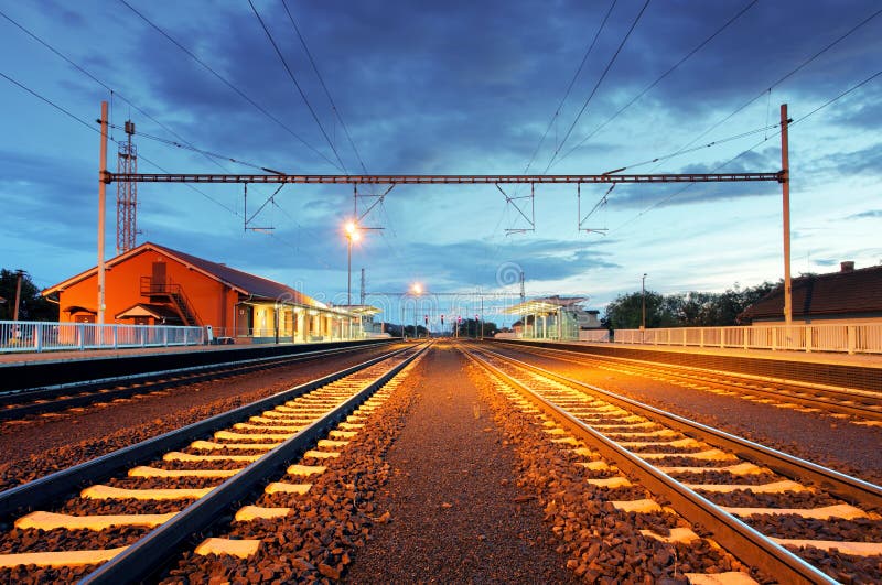 Train station in motion blur at night, railroad