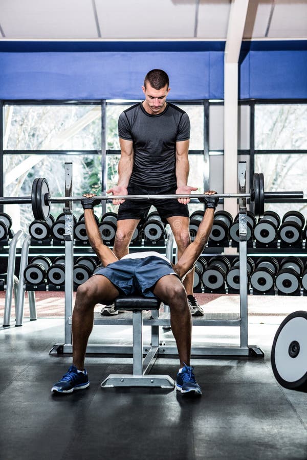 Trainer Helping Muscular Man Lifting Barebell Stock Photos Free