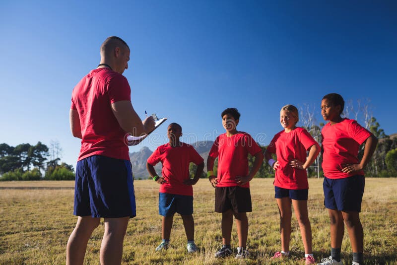 Trainer Instructing Kids In The Boot Camp Stock Photo Image Of Male