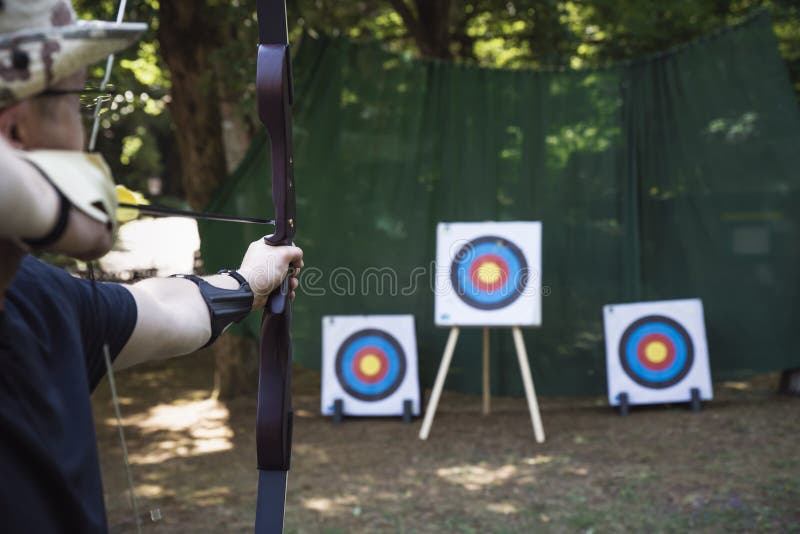 Training Exercises for Shooting Archery on an Outdoor Target. Stock