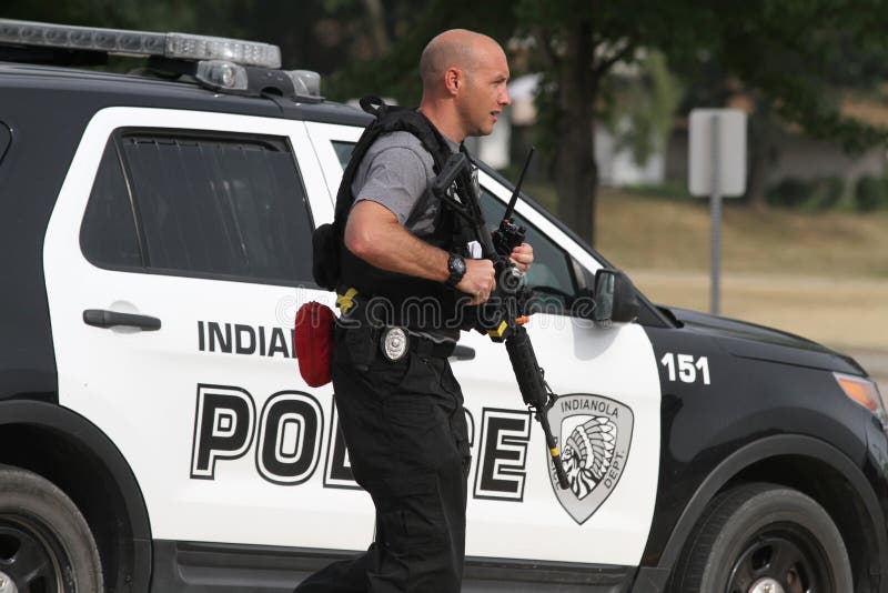 An Indianola, Iowa, USA, police officer carries a rifle during an active shooter training session on Aug. 4, 2018, in Indianola, Iowa, USA. An Indianola, Iowa, USA, police officer carries a rifle during an active shooter training session on Aug. 4, 2018, in Indianola, Iowa, USA