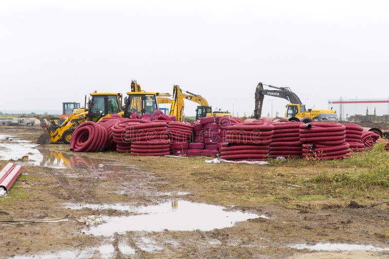 Traktorer, bulldozrar och avklopprör arkivfoto Traktorer, bulldozrar och avklopprör arkivfoto