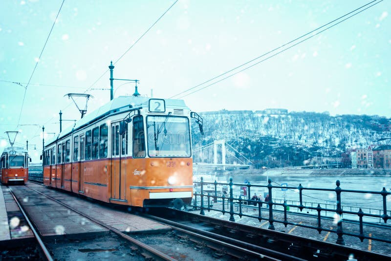 Tram in winter while snowing in budapest hungary