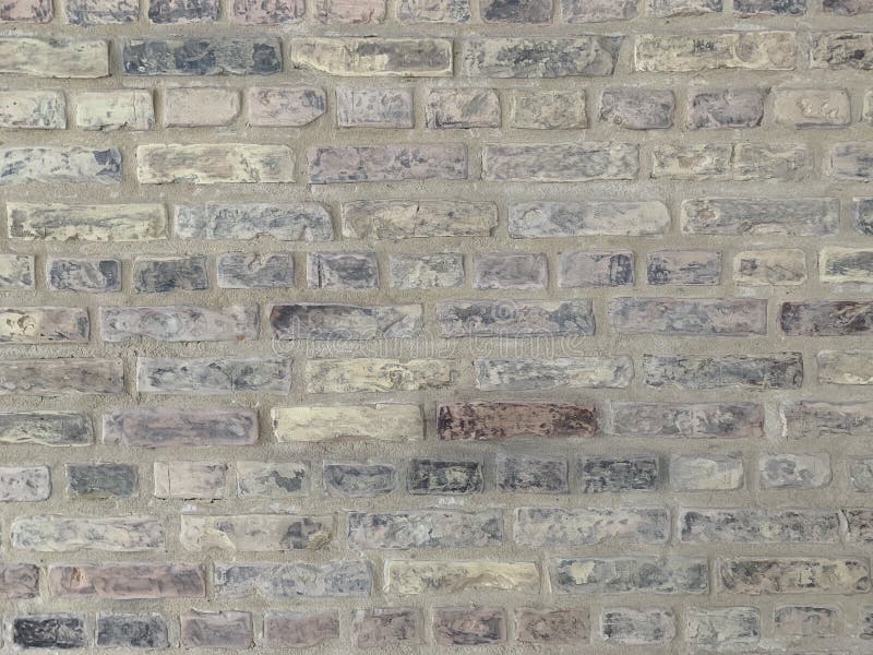 Trama in muratura per la progettazione. il muro di mattoni è lucidato e dipinto. sfondo con spazio per testo o immagine. muro di p fotografie stock