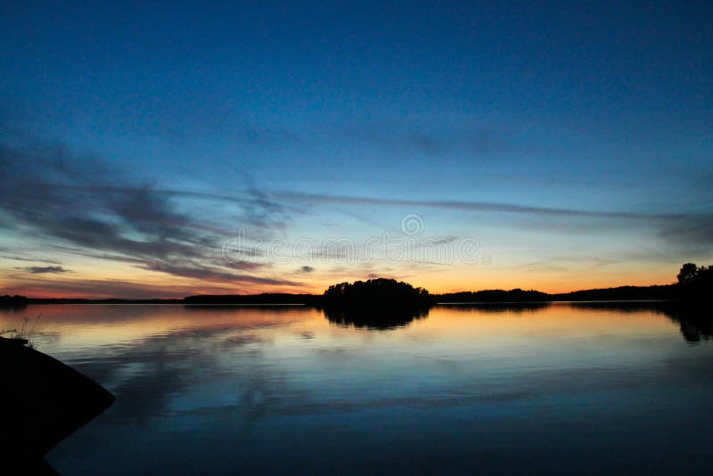 Tramonto calmo al mare fotografia stock libera da diritti Tramonto calmo al mare fotografia stock libera da diritti