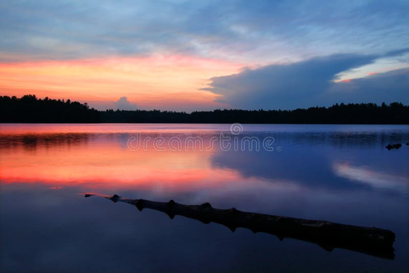 Brilliant colors of sunset over Buffalo Lake in the Northern Highland American Legion State Forest of Wisconsin. Brilliant colors of sunset over Buffalo Lake in the Northern Highland American Legion State Forest of Wisconsin.