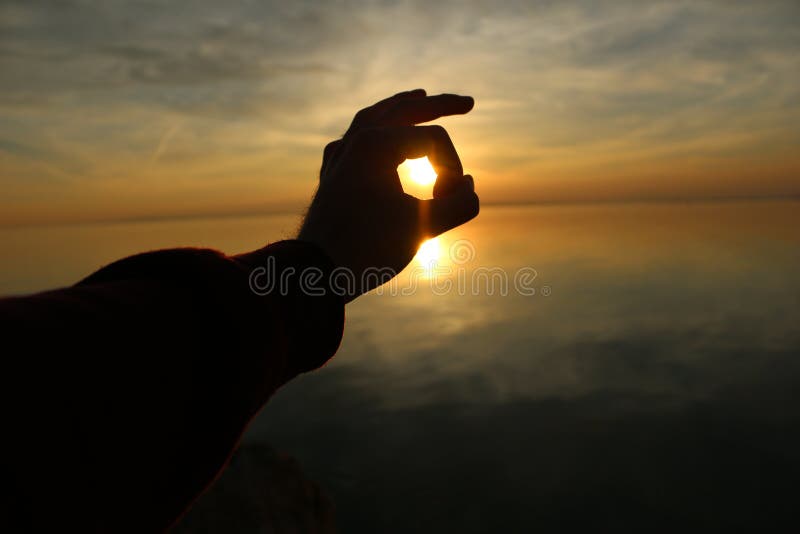 Tramonto in mia mano fotografia stock Tramonto in mia mano fotografia stock