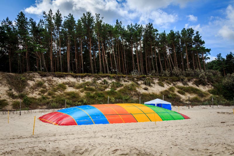 Trampoline on the beach stock photo. Image of ocean, poland 44611408
