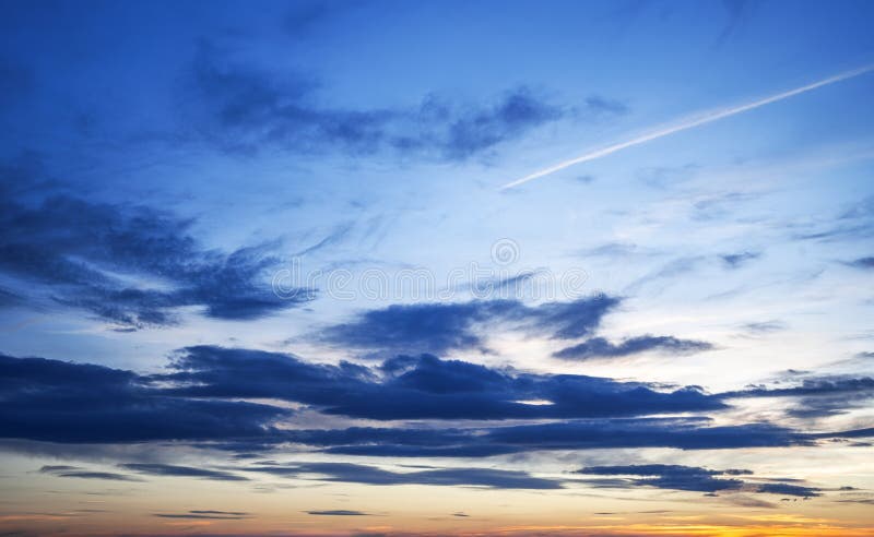 A tranquil evening sky with soft clouds stock images