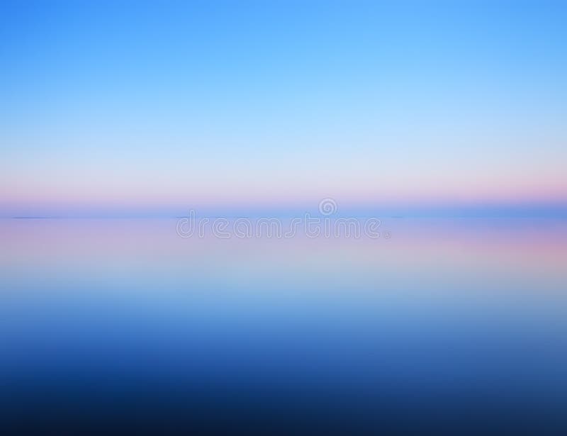 Tranquil minimalist landscape of calm water and horizon