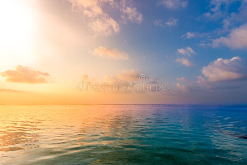 Relaxing and calm sea view. Open ocean water and sunset sky. Tranquil nature background. Infinity sea horizon