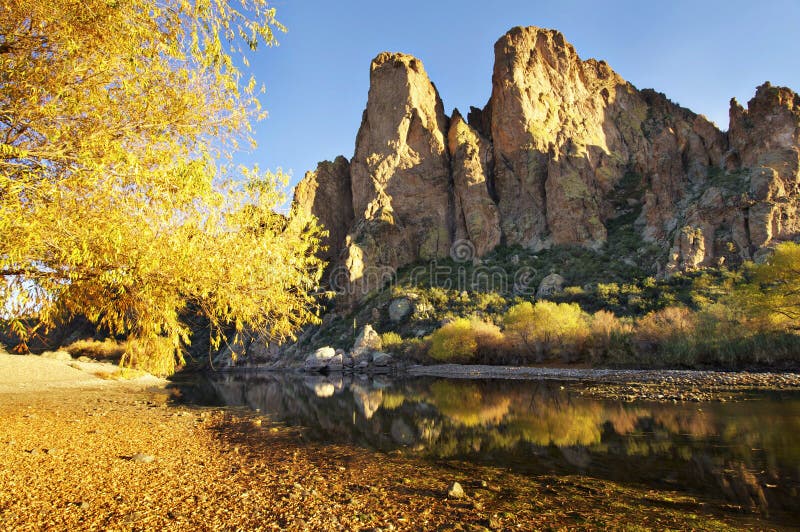 Tranquil water creek beside mountain stock photos