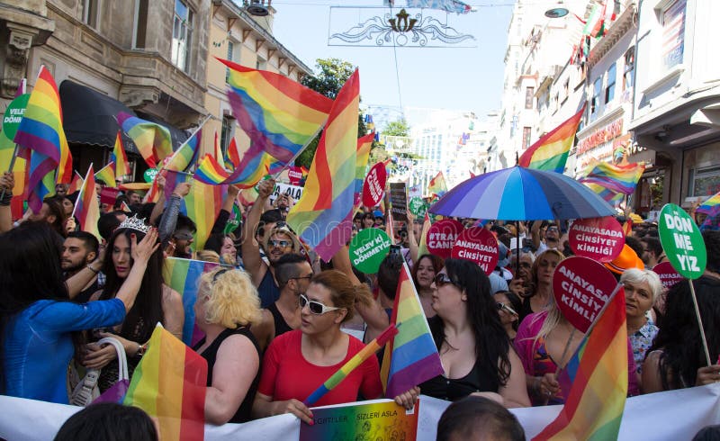 ISTANBUL, TURKEY - JUNE 22, 2014: 5. Trans Pride March held in Istiklal Avenue, Istanbul. Thousands of people gathered to celebrate begining of LGBT Honor week. ISTANBUL, TURKEY - JUNE 22, 2014: 5. Trans Pride March held in Istiklal Avenue, Istanbul. Thousands of people gathered to celebrate begining of LGBT Honor week.