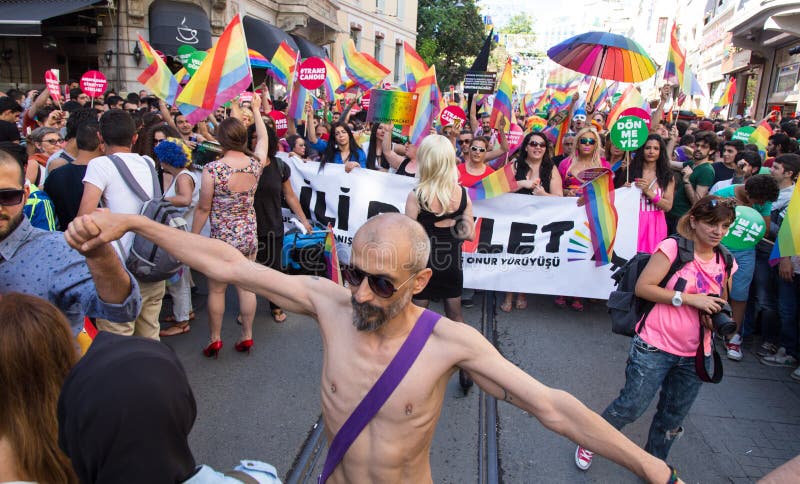 ISTANBUL, TURKEY - JUNE 22, 2014: 5. Trans Pride March held in Istiklal Avenue, Istanbul. Thousands of people gathered to celebrate begining of LGBT Honor week. ISTANBUL, TURKEY - JUNE 22, 2014: 5. Trans Pride March held in Istiklal Avenue, Istanbul. Thousands of people gathered to celebrate begining of LGBT Honor week.